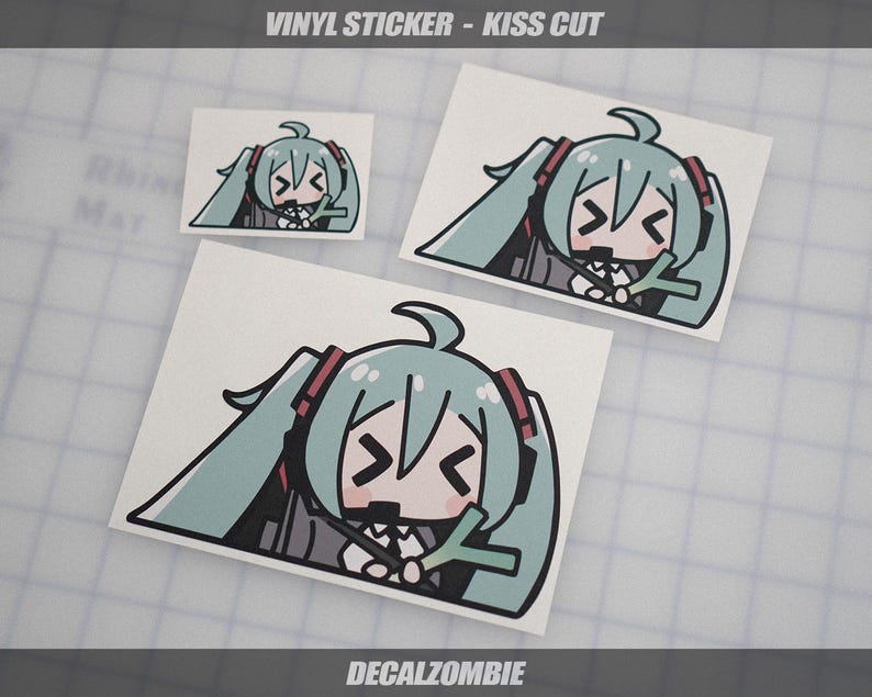 May include: Vinyl stickers with a kiss-cut design featuring a cartoon character with long, light teal pigtails, red accents, and a black outline. The stickers are on a white background, with the text "VINYL STICKER - KISS CUT" and "DECALZOMBIE".