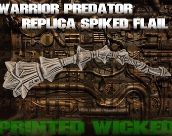 May include: A replica spiked flail with the text "WARRIOR PREDATOR REPLICA SPIKED FLAIL" and "PRINTED WICKED". The weapon is a light gray color with a detailed, textured design. The background is a dark, metallic surface.