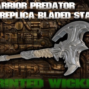 May include: A clear, bladed staff with intricate detailing, featuring a curved blade design. The staff has a long handle and is set against a textured, metallic background. Text on the image reads "WARRIOR PREDATOR REPLICA BLADED STAFF" and "PRINTED WICKED".