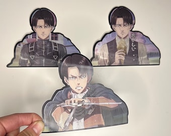 May include: Three anime character stickers featuring a young man with black hair and a serious expression. The stickers are printed on a white background and have a glossy finish.