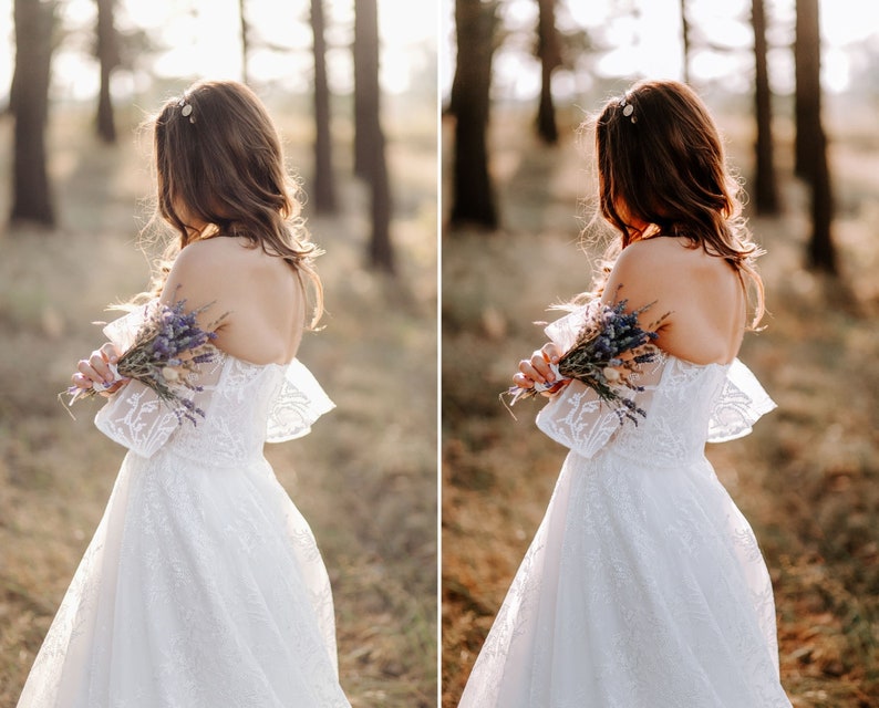 May include: A white off-the-shoulder dress featuring intricate lace detailing, short flared sleeves, and a full skirt. The garment is paired with a small bouquet of dried purple lavender flowers held against the back of the bodice.