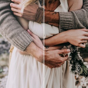 May include: A cream-colored sleeveless dress featuring a gathered bodice and a flowing skirt, paired with a textured beige knit sweater. The ensemble is accented by a dried floral arrangement held in hand, showcasing natural tones and soft fabric textures.