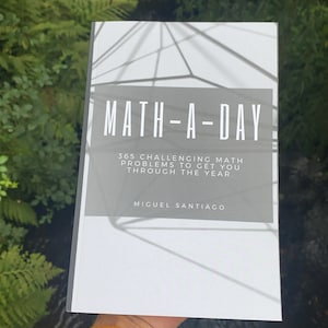 May include: A white book with a gray title bar that reads "MATH-A-DAY 365 CHALLENGING MATH PROBLEMS TO GET YOU THROUGH THE YEAR." The author's name, "MIGUEL SANTIAGO", is printed below the title.