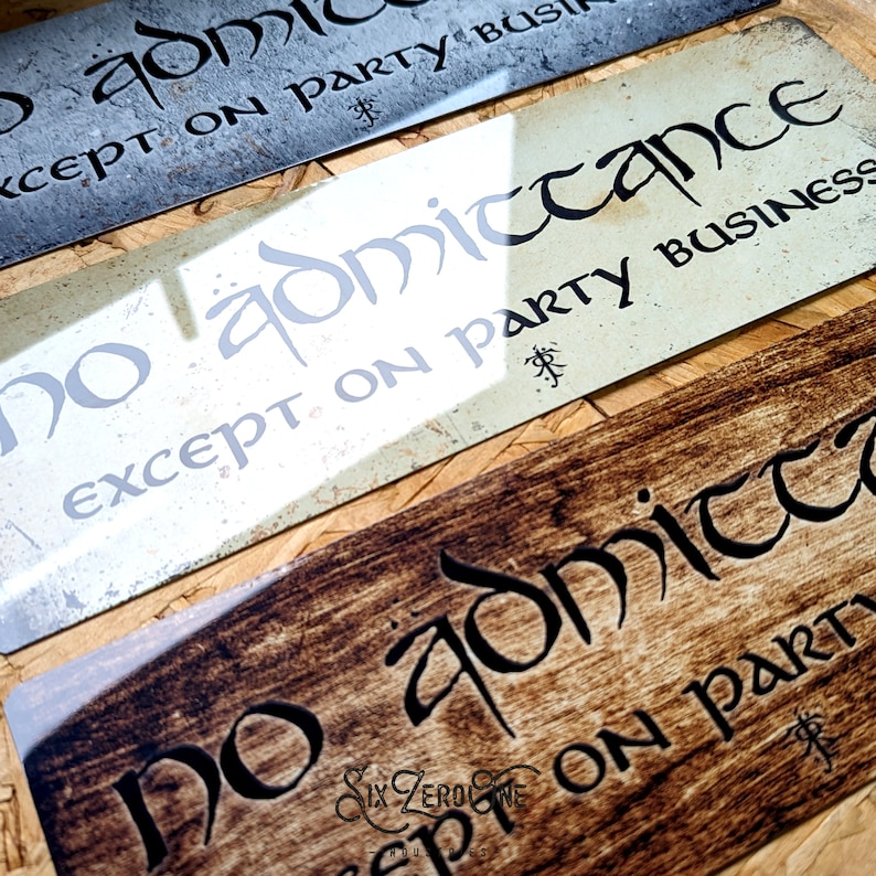 May include: Three metal signs with a rustic woodgrain finish. Each sign features the text "No admittance except on party business" in a stylized font.