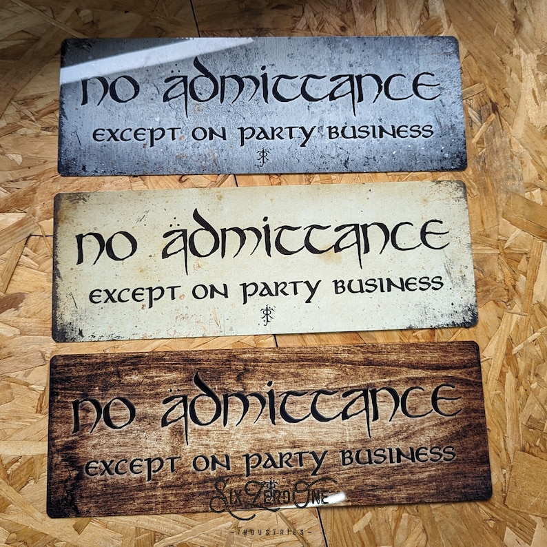 May include: Three rustic metal signs with the text "no admittance except on party business" in a decorative font. The signs are in different colors: gray, white, and brown.
