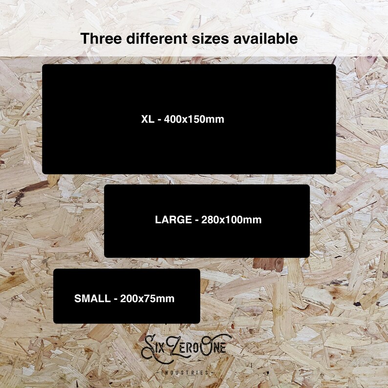 May include: Three different sizes of a black rectangular sign with white text. The text reads "XL - 400x150mm", "LARGE - 280x100mm", and "SMALL - 200x75mm". The signs are on a wood-grain background.