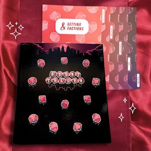 May include: A black binder titled Storyteller with red melting dice graphics and a city skyline silhouette. It includes matching tabbed dividers in shades of red and purple, with one labeled Setting & Factions, featuring a repeating dice pattern.