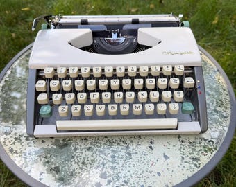 Machine à écrire Olympia SF en état de marche | Vintage 1962 | Machine à écrire ultra-portable | Blanche et grise | Manuelle | Allemagne