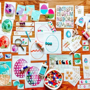 May include: A collection of Easter-themed educational activities for children, including colorful eggs, alphabet blocks, counting activities, and a ten frame. The activities are laid out on a wooden surface.