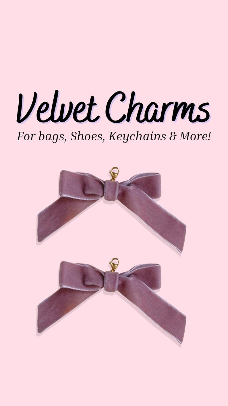 May include: Two mauve velvet bow charms with gold-colored clasps, displayed on a light pink background. The text "Velvet Charms" and "For bags, Shoes, Keychains & More!" are displayed above the bows.