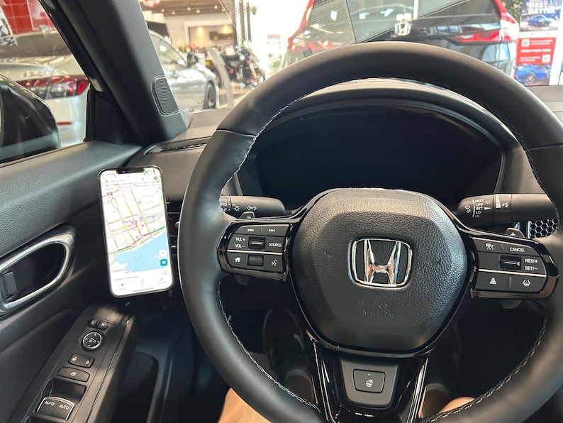 2023+ Honda CR-V MagSafe phone mount installed on dashboard honeycomb vent for 6th generation CR-V models 2023 2024 2025 2026. Custom vent phone holder with ultra strong MagSafe magnet for secure hands-free driving. Honda CRV phone mount compatible with iPhone 12 13 14 15 16 and Android using MagSafe ring. Adjustable CR-V dashboard phone holder for driver and passenger use, no tools or adhesive required.