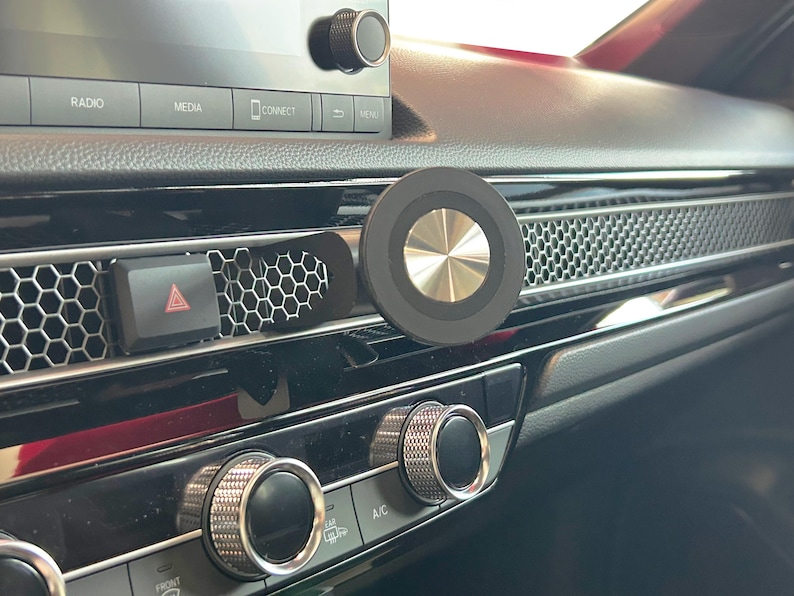 2023+ Honda CR-V MagSafe phone mount installed on dashboard honeycomb vent for 6th generation CR-V models 2023 2024 2025 2026. Custom vent phone holder with ultra strong MagSafe magnet for secure hands-free driving. Honda CRV phone mount compatible with iPhone 12 13 14 15 16 and Android using MagSafe ring. Adjustable CR-V dashboard phone holder for driver and passenger use, no tools or adhesive required.