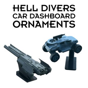 May include: Two gray plastic Hell Divers car dashboard ornaments. One is a detailed spaceship model on a black stand, and the other is a rugged off-road vehicle with a roof-mounted weapon on a black stand. The text HELL DIVERS CAR DASHBOARD ORNAMENTS is visible.