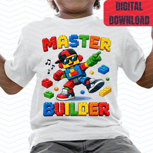 May include: White t-shirt with a colorful graphic of a Lego-style character wearing sunglasses and a backwards cap. The words "MASTER BUILDER" are printed in block letters above and below the character. The image also includes musical notes and scattered Lego bricks.