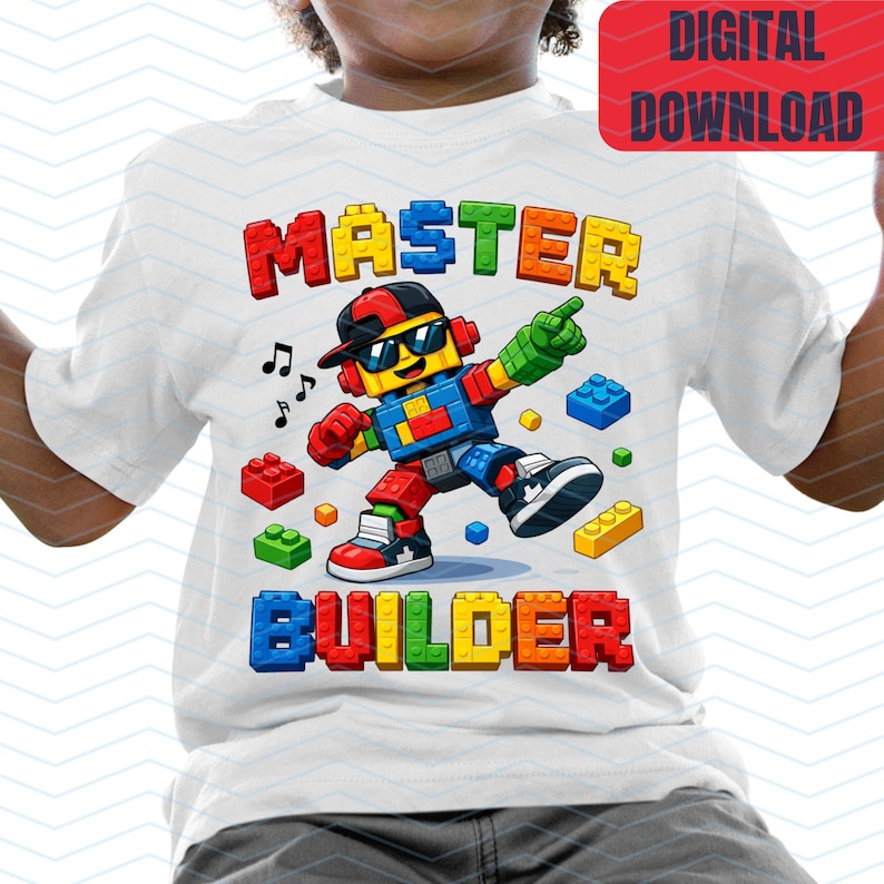 May include: White t-shirt with a colorful graphic of a Lego-style character wearing sunglasses and a backwards cap. The words "MASTER BUILDER" are printed in block letters above and below the character. The image also includes musical notes and scattered Lego bricks.