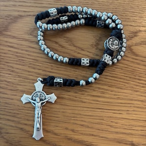 May include: A rustic wooden sign with the text "Welcome to our home" in white lettering. The sign features a distressed finish and a simple, inviting design, perfect for front door decor.