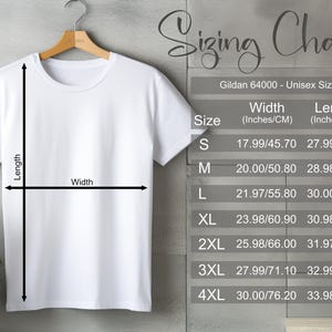 May include: A white Gildan 64000 unisex t-shirt hanging on a wooden hanger. The image includes a sizing chart with measurements in inches and centimeters for sizes S through 4XL. The chart shows the width and length of the shirts.