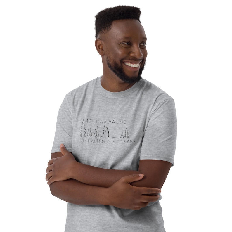 Unisex T-Shirt mit einem minimalistischen Design mit Bäumen und der Aufschrift: Ich mag Bäume die halten die Fresse.