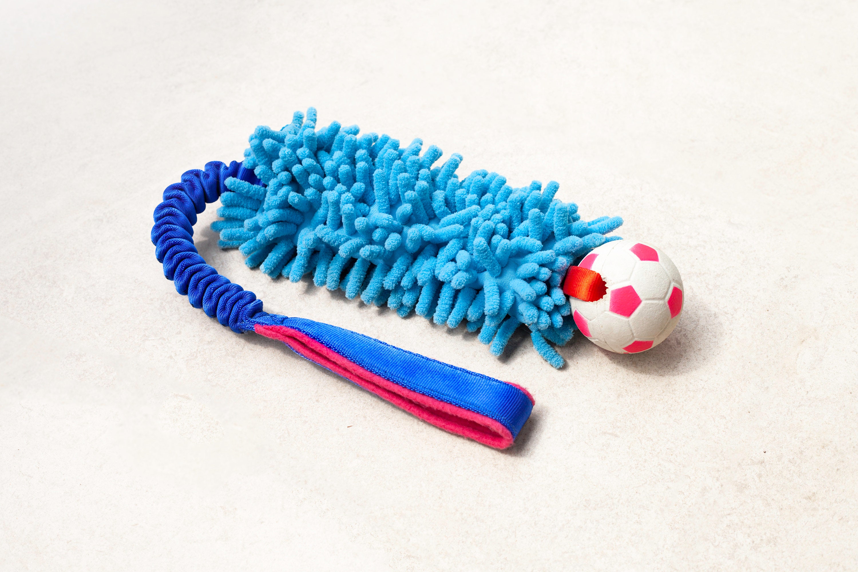 Tug toy top