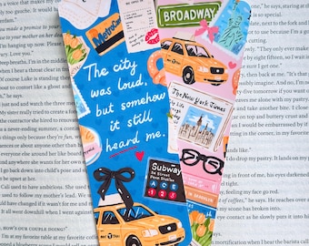 May include: Two rectangular bookmarks featuring New York City illustrations. One is blue with a yellow taxi, a black bow, and the text 'The city was loud, but somehow it still heard me.' The other is pink with a yellow taxi, Broadway sign, and glasses.