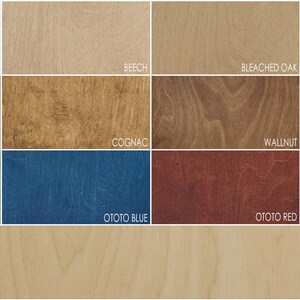 May include: A wood stain color chart with 12 different wood stain colors, including white, beech, bleached oak, light oak, teak, cognac, walnut, black, ototo green, ototo blue, ototo red, antique oak, and natural.