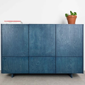 Minimalist japandi sideboard with three cabinets and three drawers made of birch plywood.