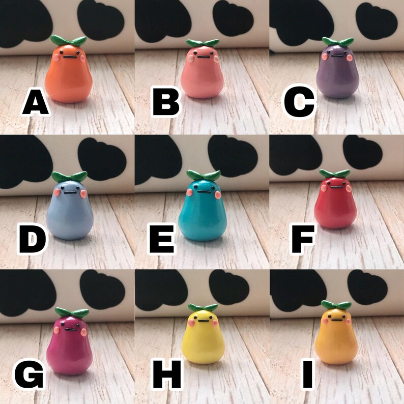 May include: Nine small pear-shaped figurines with different colors and facial expressions. The figurines are made of polymer clay and have a glossy finish. The colors include orange, pink, purple, light blue, turquoise, red, magenta, yellow, and orange.