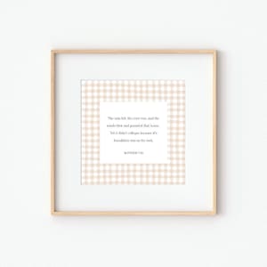 May include: A framed print with a light wood frame. The print features a white background with a beige gingham pattern. A white rectangle in the center contains text from Matthew 7:25.