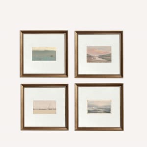 May include: Four framed watercolour landscape paintings. Each painting shows a tranquil waterscape with boats and soft, muted colours. The frames are gold with a beaded edge, adding a touch of elegance to the artwork.