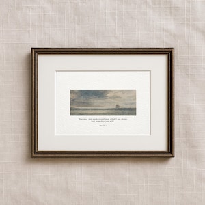 May include: Framed art print featuring a seascape painting with a sailboat under a cloudy sky. The print includes the quote, "You may not understand now what I am doing, but someday you will." in a serif font.