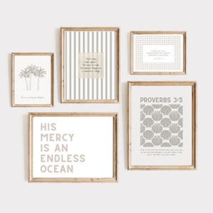 May include: A set of framed art prints with motivational quotes and minimalist designs. The prints feature text, palm tree illustrations, and seashell patterns in neutral tones, framed in light wood.