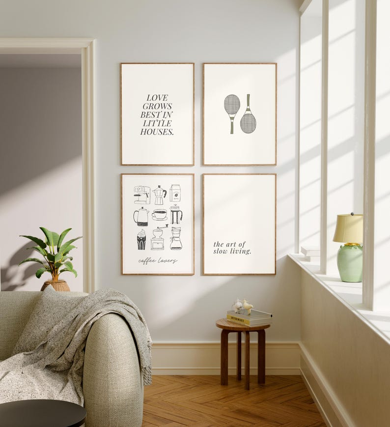 May include: Four framed art prints with minimalist designs. One print reads "LOVE GROWS BEST IN LITTLE HOUSES." Another features tennis rackets. A third displays coffee-related illustrations, and the last says "the art of slow living."