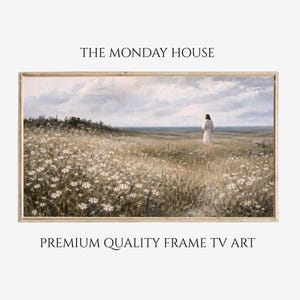 May include: Framed artwork featuring a serene landscape with a figure in white standing in a field of wildflowers. The artwork is set against a backdrop of a cloudy sky and a distant body of water. The text "THE MONDAY HOUSE" and "PREMIUM QUALITY FRAME TV ART" are displayed.