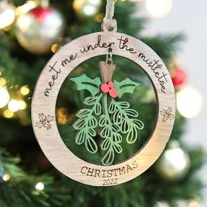 Under the mistletoe ornament, present, decor, Christmas