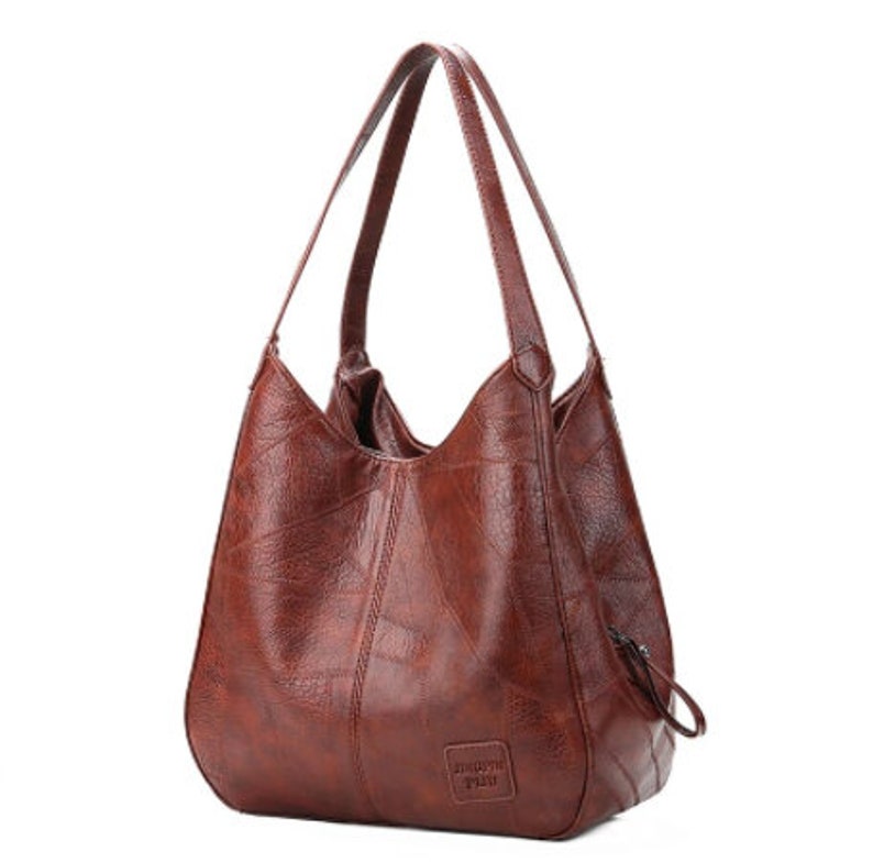 upcycled billboard bolsas