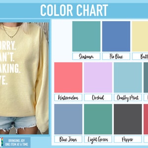 May include: A color chart with 12 different color swatches. The colors are: Seafoam, Flo Blue, Butter, Watermelon, Orchid, Chalky Mint, Blue Spruce, Blue Jean, Light Green, Pepper, and Crimson. The text "Sorry. Can't. Baking. Bye." is printed on a yellow sweatshirt.