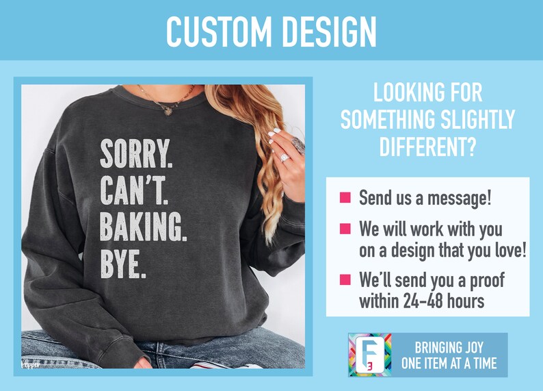 May include: A black sweatshirt with the text "SORRY. CAN'T. BAKING. BYE." printed in white. The sweatshirt is being modeled by a person.