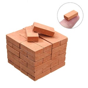 May include: A stack of 48 miniature red brick blocks for model building and crafting projects. The bricks are approximately 2.5 cm long and 1.25 cm wide.