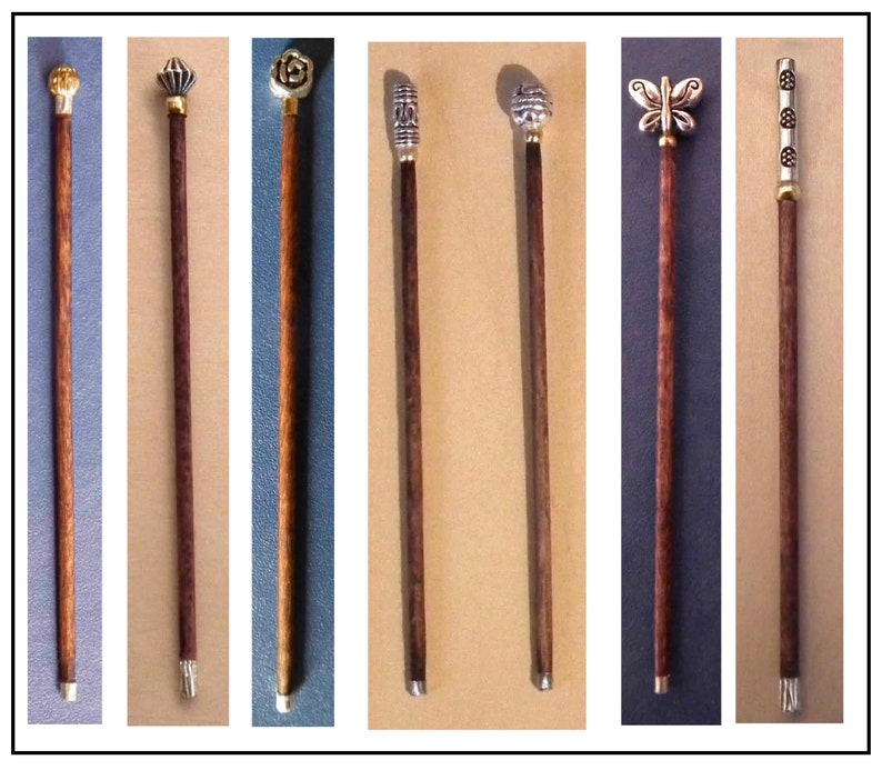 May include: Eight decorative walking sticks with different metal tops. The tops feature a variety of designs, including a flower, a butterfly, and geometric patterns. The sticks are all made of dark wood.