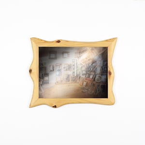 May include: A light-colored wooden picture frame with a wavy, organic shape. The frame surrounds a blurred image of a room filled with artwork and shelves. The frame has visible wood grain and knots.