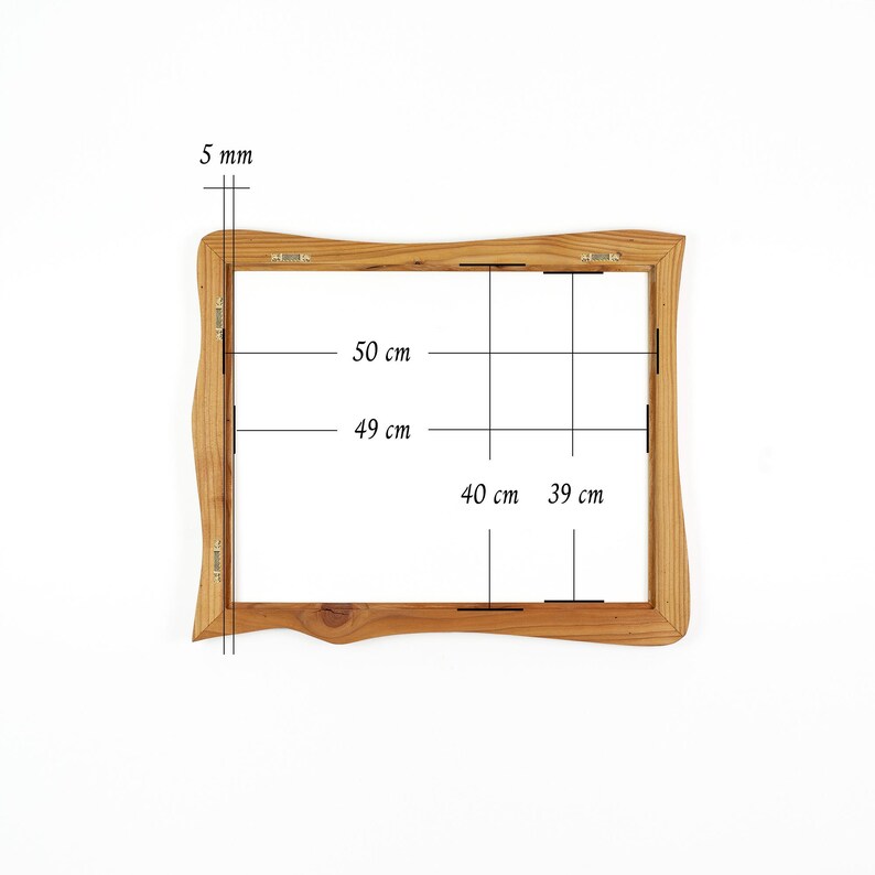 May include: A rectangular wooden picture frame with wavy, organic edges. The frame features metal hanging hardware on the back. Technical annotations indicate dimensions of 50 cm by 40 cm for the outer edge and 49 cm by 39 cm for the inner opening, with a 5 mm thickness.