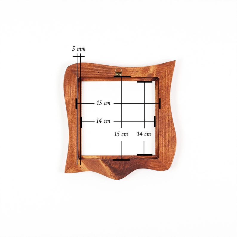 May include: A wooden picture frame with a wavy edge. The frame's inner dimensions are 15 cm x 15 cm and 14 cm x 14 cm. The frame is 5 mm thick. The frame has a hanging hook on the back.