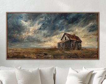 May include: A painting of a weathered, abandoned house in a field with a dramatic stormy sky. The house is painted in shades of gray and brown, with a rusty red roof. The sky is a mix of dark blue, gray, and white clouds. The painting is framed in a brown wood frame.