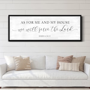 May include: Black and white framed wall art with the text "As for me and my house, we will serve the Lord" and the scripture reference "Joshua 24:15".