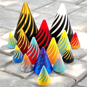 May include: A collection of 13 colorful, cone-shaped, decorative items with a spiral pattern. The cones are made of various materials, including wood, metal, and plastic. The cones are arranged in a pyramid shape, with the largest cone at the top and the smallest cones at the bottom.
