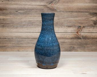 Unique narrow neck vase with cobalt blue ice-crackle glaze. Made from black stoneware. Height 17.5 cm