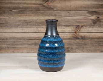 Narrow neck vase with cobalt blue ice-crackle glaze made from black stoneware. Height 16cm.