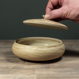 Lidded ceramic storage jar from marbled stoneware, perfect for nuts and candies. Volume ~450ml.