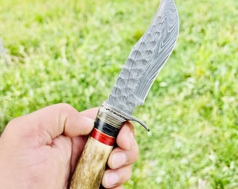 Collectible hand-forged Damascus stag hunting knife with Damascus blade and leather sheath with stag horn handle.