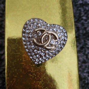 silver chanel pin brooch